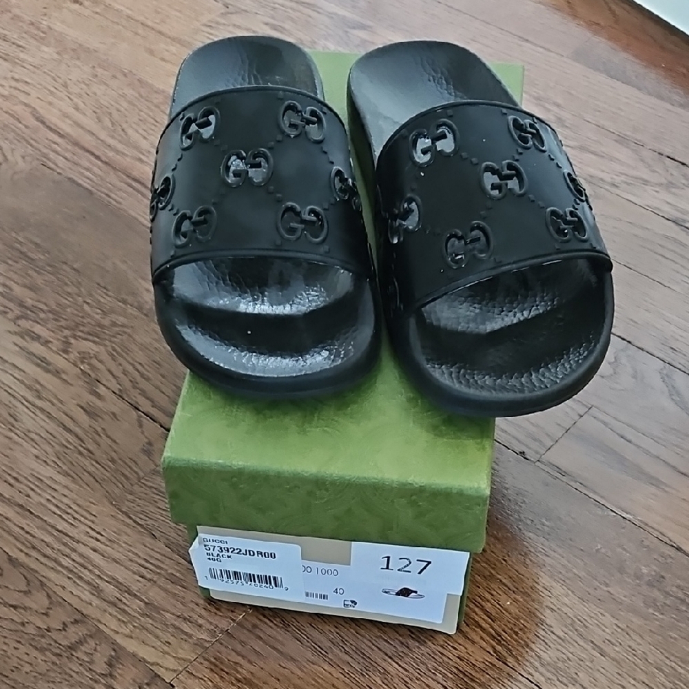 Gucci Black Slippers with Embossed Pattern